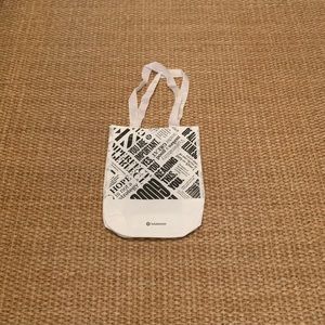 White and black lululemon shoulder bag.